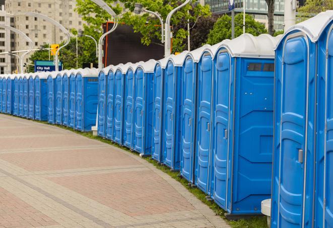 a line of brightly-colored portable restrooms, perfect for outdoor festivals and concerts in Queen Valley AZ